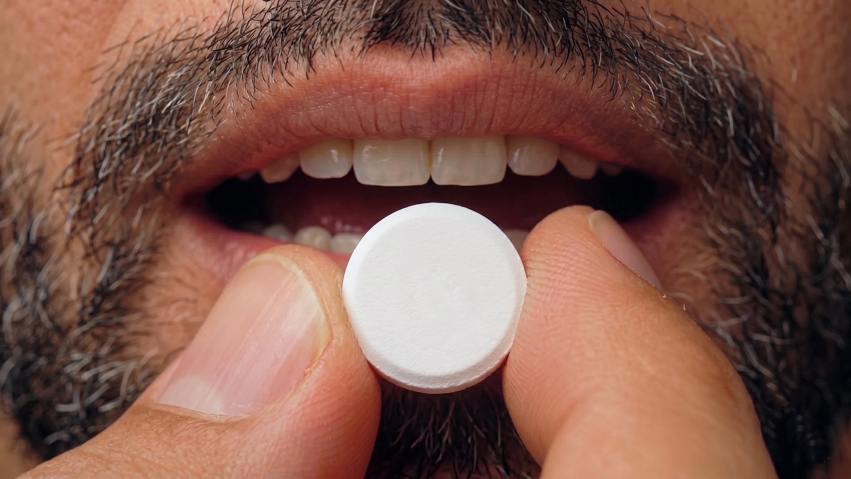Placing the tablet under the tongue